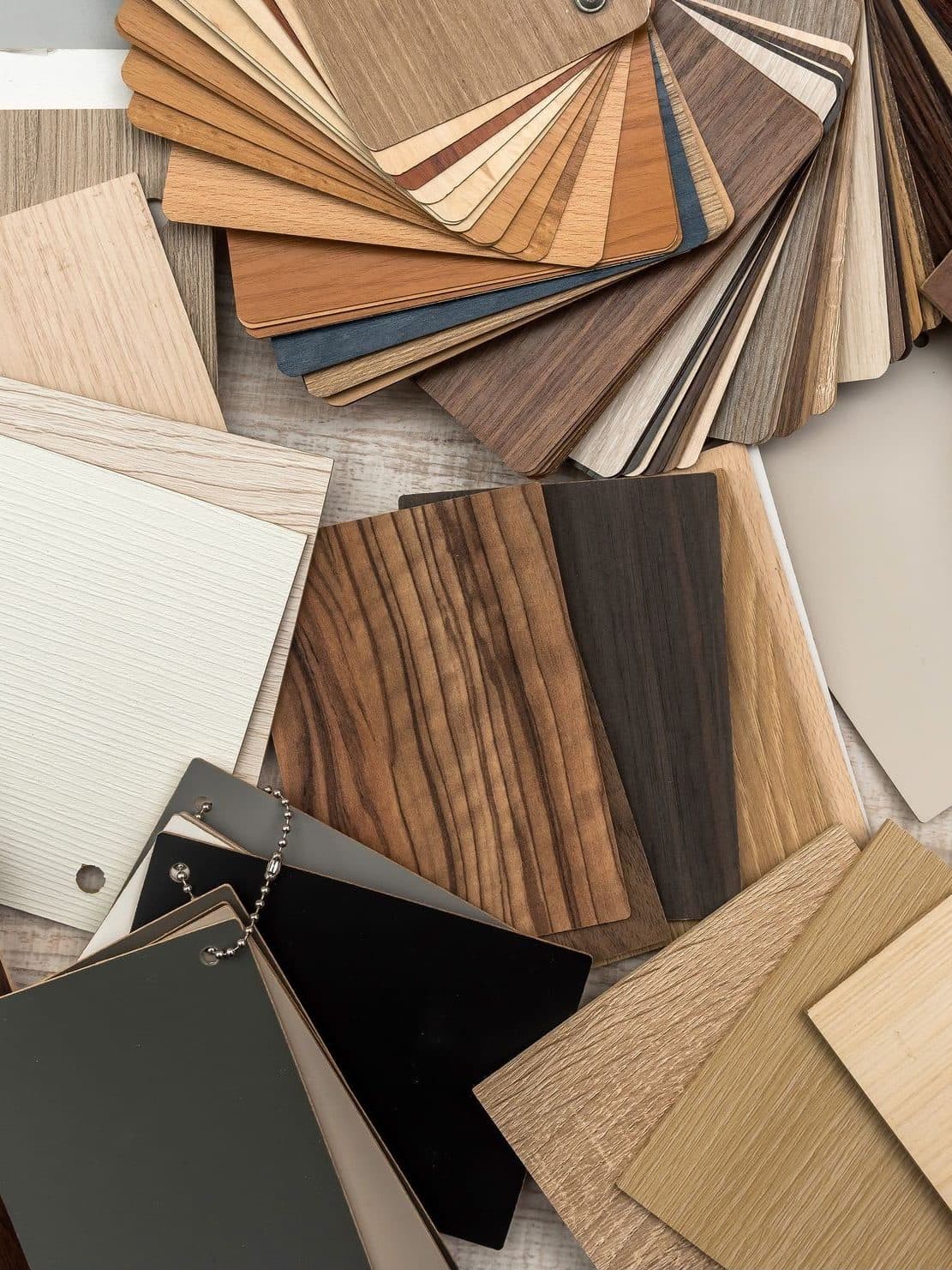 Wood flooring samples fanned out across a table